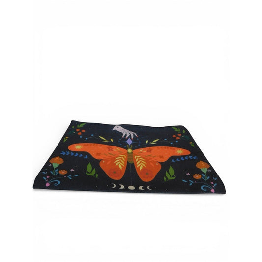 The Witches' Quest canvas clutch featuring a vibrant orange butterfly, celestial moon phases, and floral motifs.