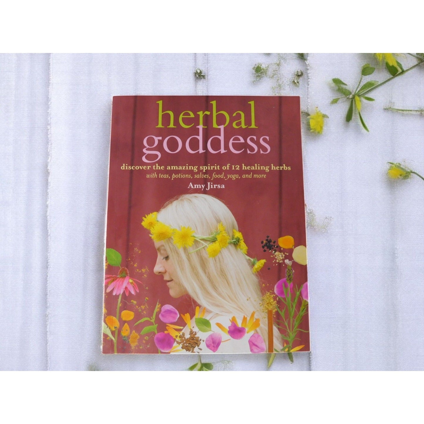 The Witches' Quest Herbal Goddess softcover book by Amy Jirsa featuring floral illustrations and holistic healing guide