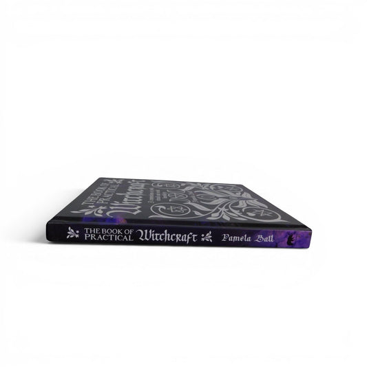 The Witches' Quest The Book of Practical Witchcraft hardcover book with silver mystical symbols on a black cover