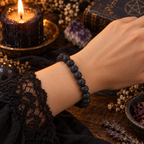 Natural lava rock 8mm stretch bracelet worn on a wrist