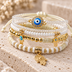Evil Eye and Hamsa layered bracelet set with white beads and gold accents