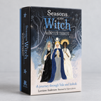 Seasons of the Witch Winter Tarot deck box featuring three figures in winter attire against a dark forest background