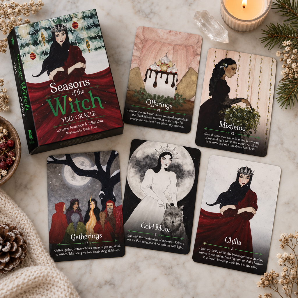 Seasons of the Witch Yule Oracle deck box and five illustrated oracle cards on a marble surface