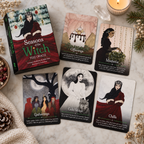 Seasons of the Witch Yule Oracle deck box and five illustrated oracle cards on a marble surface