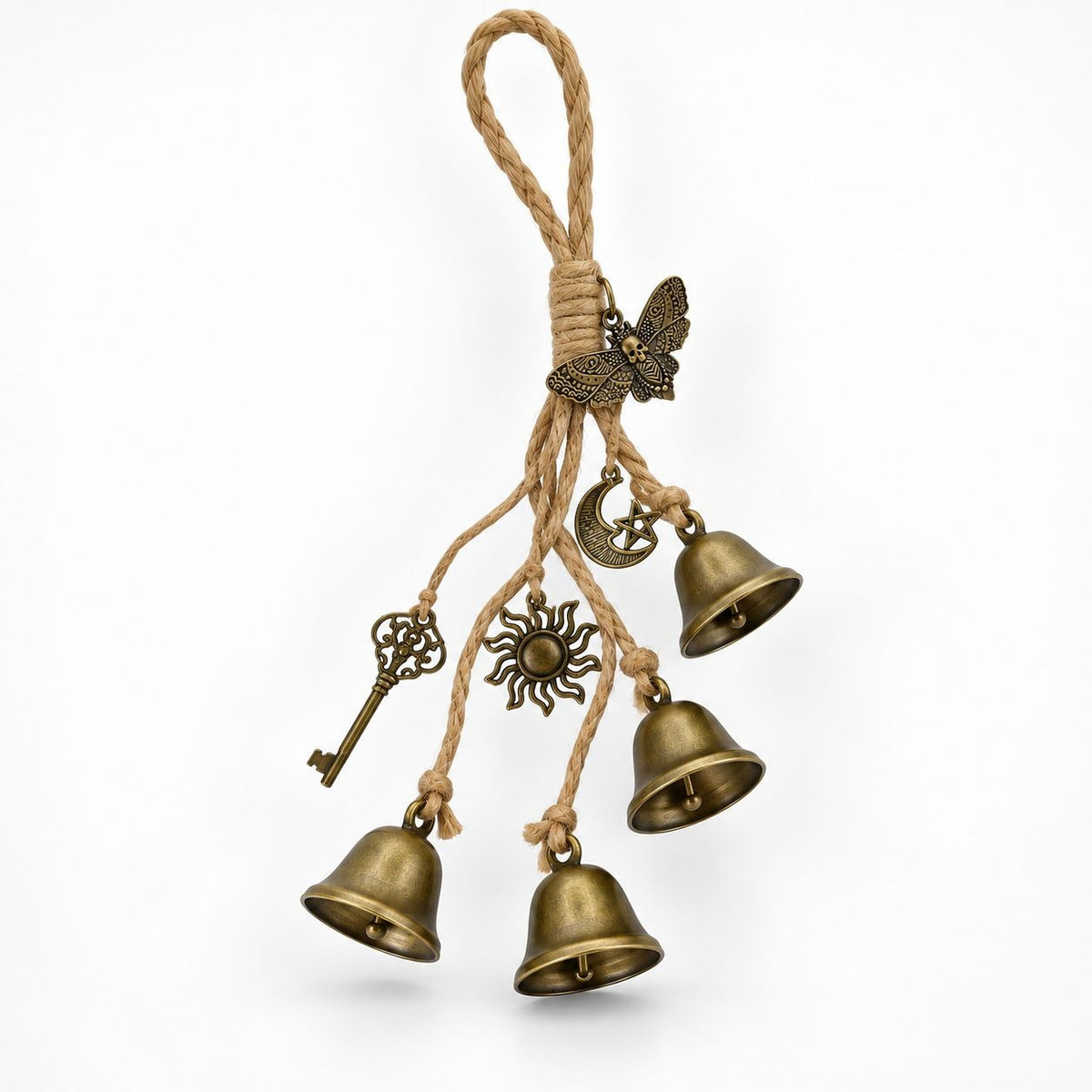 Brass-tone witch bells with sun moon key and moth charms hanging from a jute rope