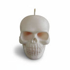 White skull shaped candle with a glittered finish