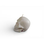 Skull shaped white candle with glitter finish