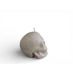 Skull shaped white candle with a glittered finish