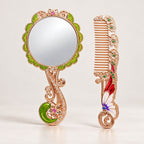 Butterfly and floral hand mirror and comb set in rose gold tone with green and red enamel accents