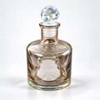 Crystal Stopper Ritual Bottle in clear glass with a spherical faceted crystal topper