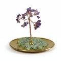 The Witches' Quest amethyst gemstone tree with wire branches on a gold tray with green aventurine crystal chips.