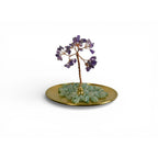 The Witches' Quest amethyst gemstone tree ornament with green aventurine chips on a gold-toned metal tray.