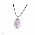 The Witches' Quest amethyst teardrop pendant with a copper wire wrapped tree of life design on a black cord necklace.