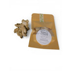 The Witches' Quest Ash & Sea whole dried ginger root in a kraft pouch for ritual spellwork and healing magic.