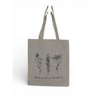 The Witches' Quest large beige canvas tote bag with black floral line art and Grow positive thoughts quote