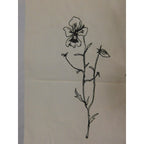 The Witches' Quest beige canvas tote bag featuring a black line art floral illustration on the front