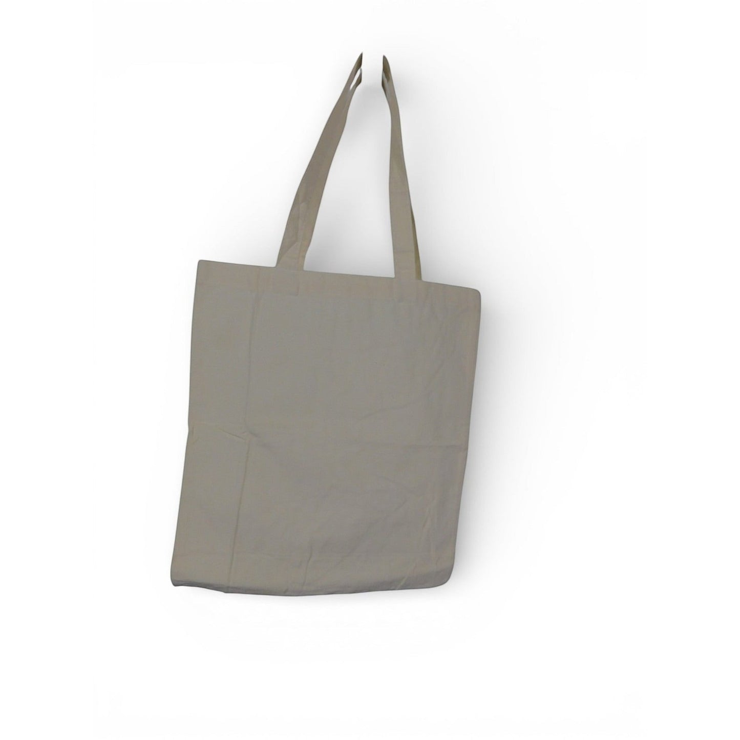 The Witches' Quest beige canvas tote bag with long shoulder straps hanging against a plain white background.