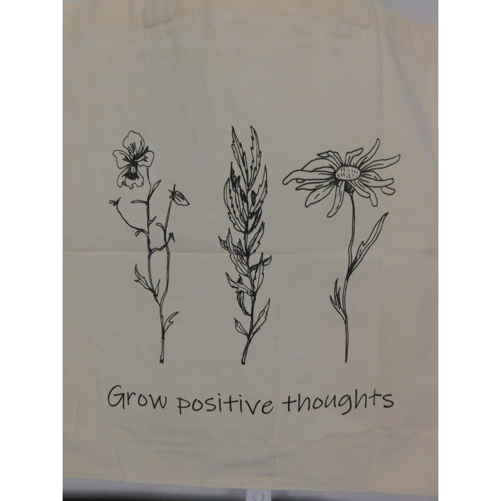 The Witches' Quest large beige canvas tote bag with black floral line art and Grow positive thoughts text