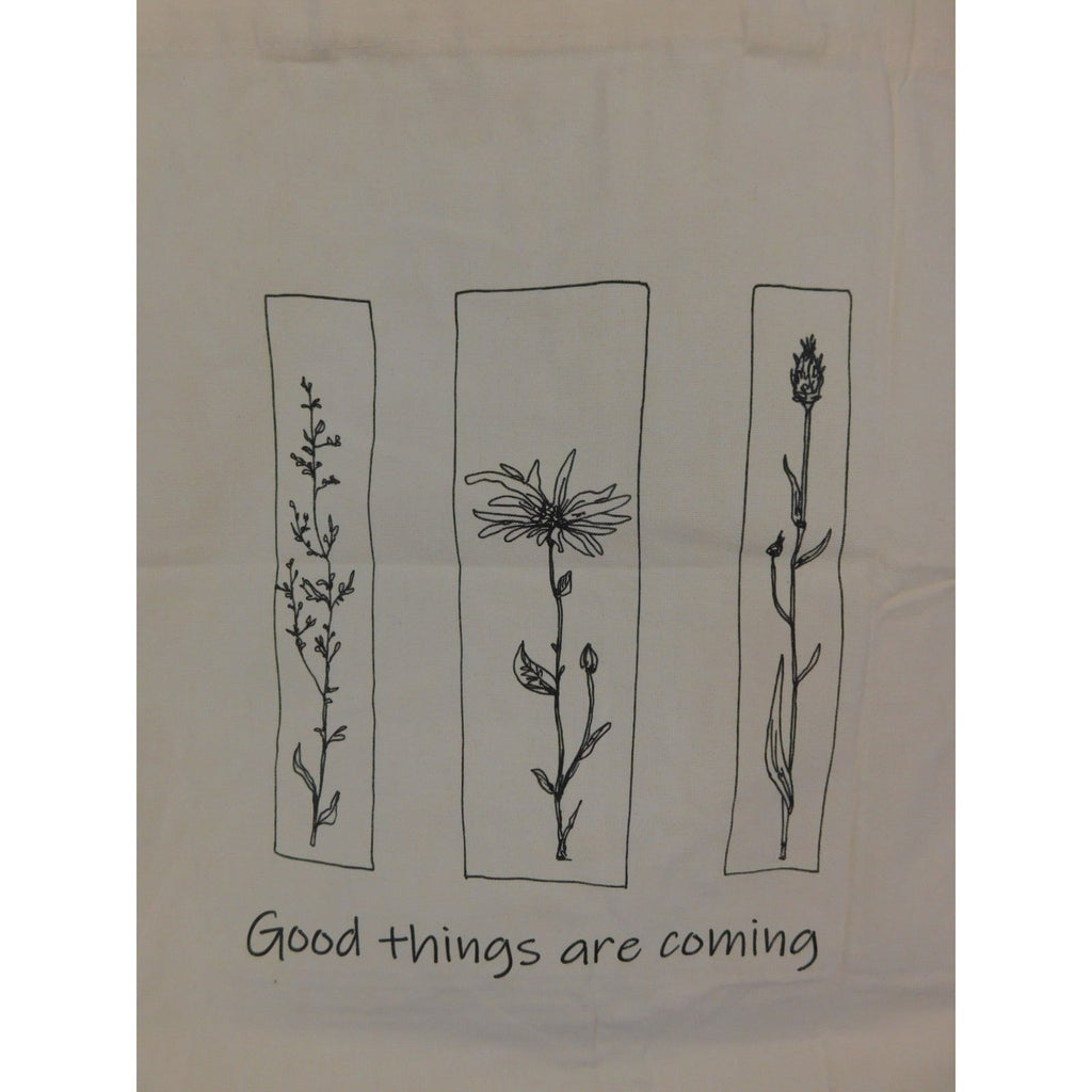The Witches' Quest beige canvas tote bag featuring black floral line art panels and Good things are coming text
