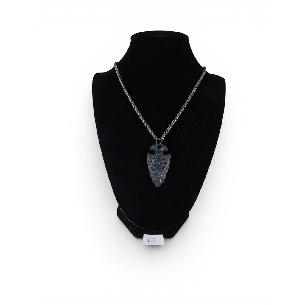 The Witches' Quest black arrowhead pendant necklace with engraved Viking compass symbol on a textured metal chain