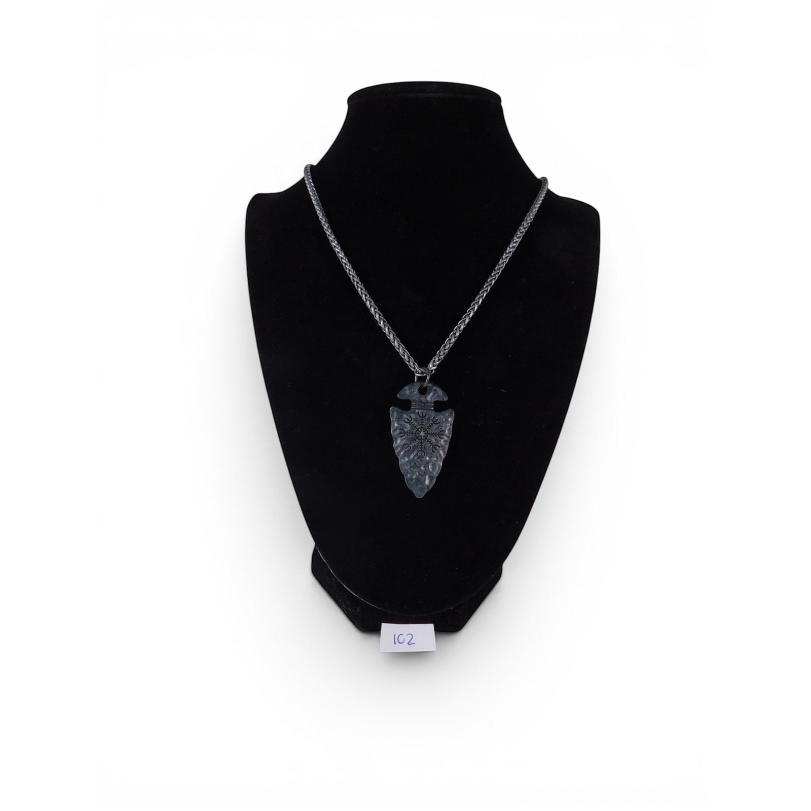 The Witches' Quest black arrowhead pendant necklace with engraved Viking compass symbol on a textured metal chain