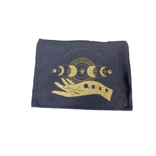 The Witches' Quest black canvas zipper pouch featuring a gold moon phase and hand design for organizing small items.