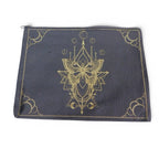 The Witches' Quest black canvas zipper pouch featuring an intricate gold moth and celestial geometric design.