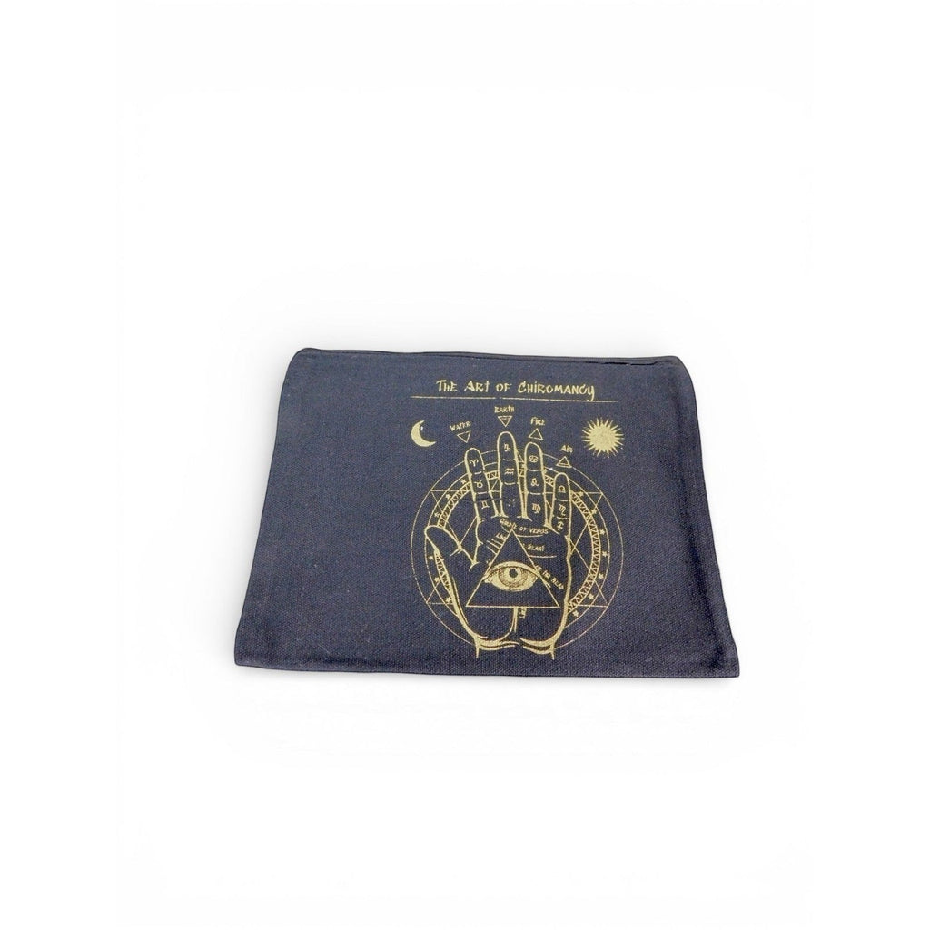 The Witches' Quest black canvas zip pouch featuring a gold Art of Chiromancy palmistry and celestial graphic print.
