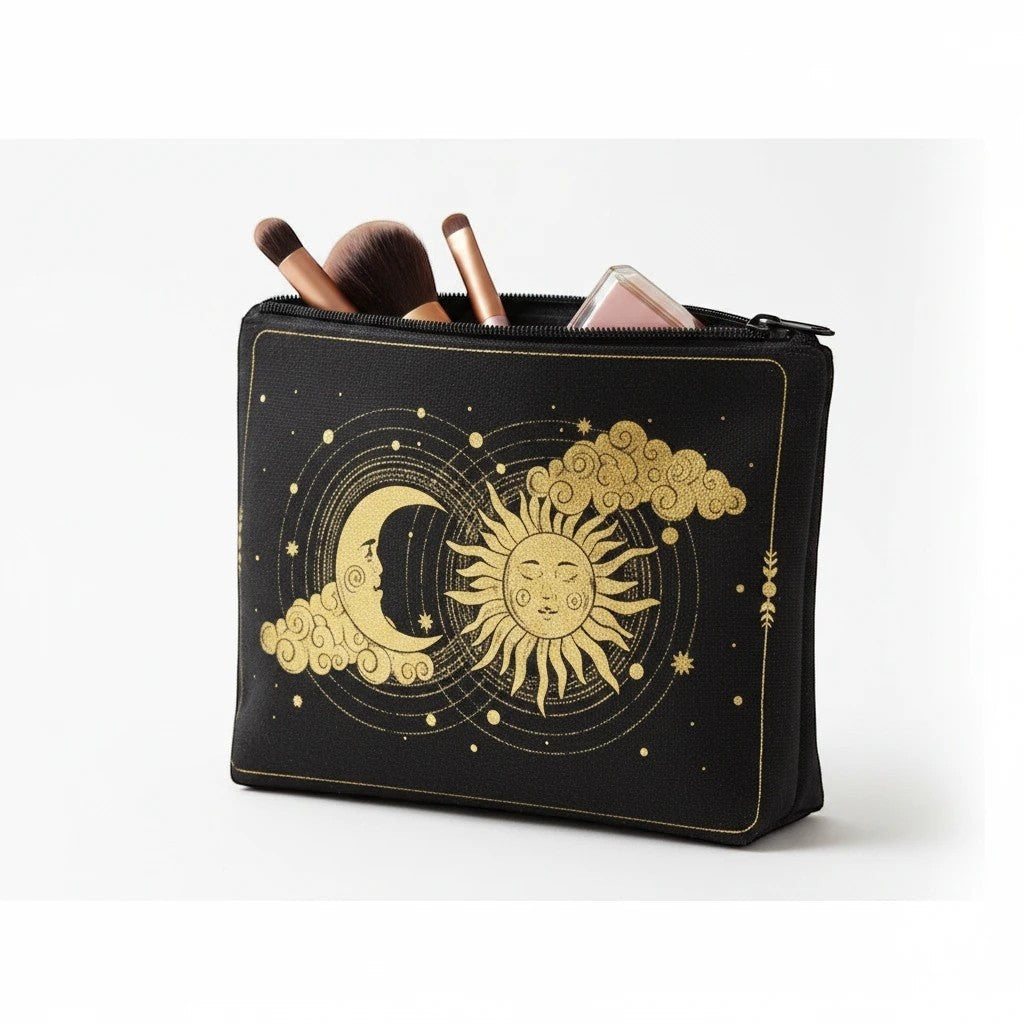 The Witches' Quest black canvas zippered pouch with gold celestial sun and moon print, holding makeup brushes.