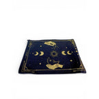 The Witches' Quest black canvas clutch with gold celestial moon, star, and hand print, featuring a top zip closure.