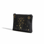 The Witches' Quest black canvas clutch featuring a gold celestial hand, moon, and sun print with a top zipper closure.