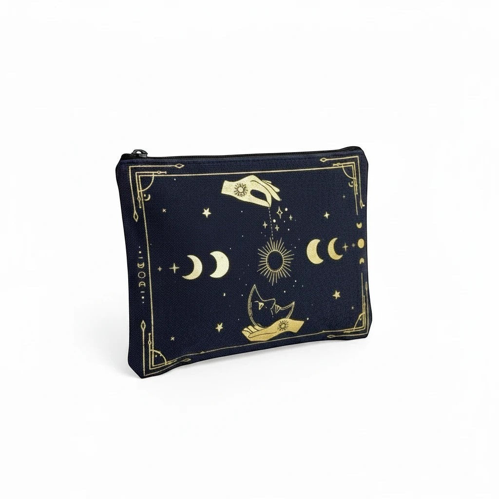The Witches' Quest black canvas clutch with gold celestial moon, star, and hand print, featuring a top zip closure.