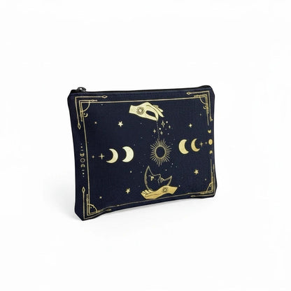 The Witches' Quest black canvas clutch with gold celestial moon, star, and hand print, featuring a top zip closure.