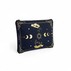 The Witches' Quest black canvas clutch with gold celestial moon, sun, and star print, featuring a top zip closure.