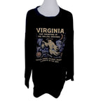 The Witches' Quest black crewneck sweatshirt featuring a vintage-style ghost graphic with pumpkins and moon motifs.