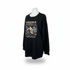 The Witches' Quest black crewneck sweatshirt featuring a vintage-style ghost graphic with pumpkins and moon motifs.