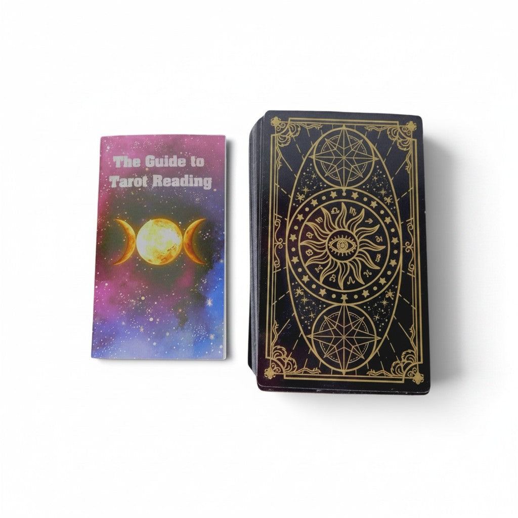 The Witches' Quest tarot deck with gold-accented black cards and a vibrant celestial guidebook on a white background.