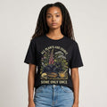 The Witches' Quest black cotton t-shirt featuring a botanical cat graphic with the text All Plants Are Edible