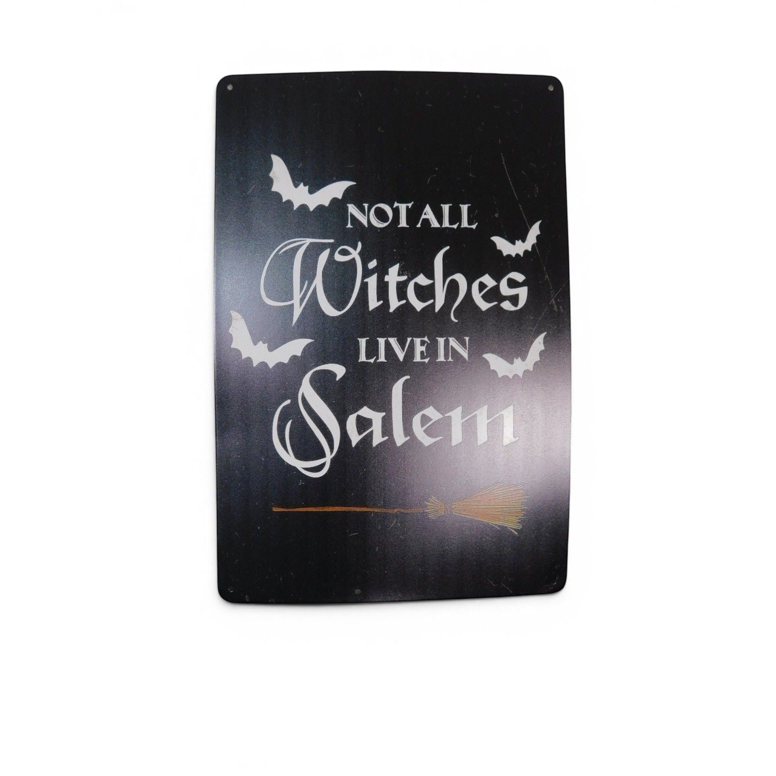 The Witches' Quest black metal wall sign with white text reading Not All Witches Live In Salem and bat graphics.