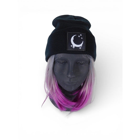 The Witches' Quest black ribbed knit beanie with a crescent moon and stars patch on a mannequin head.