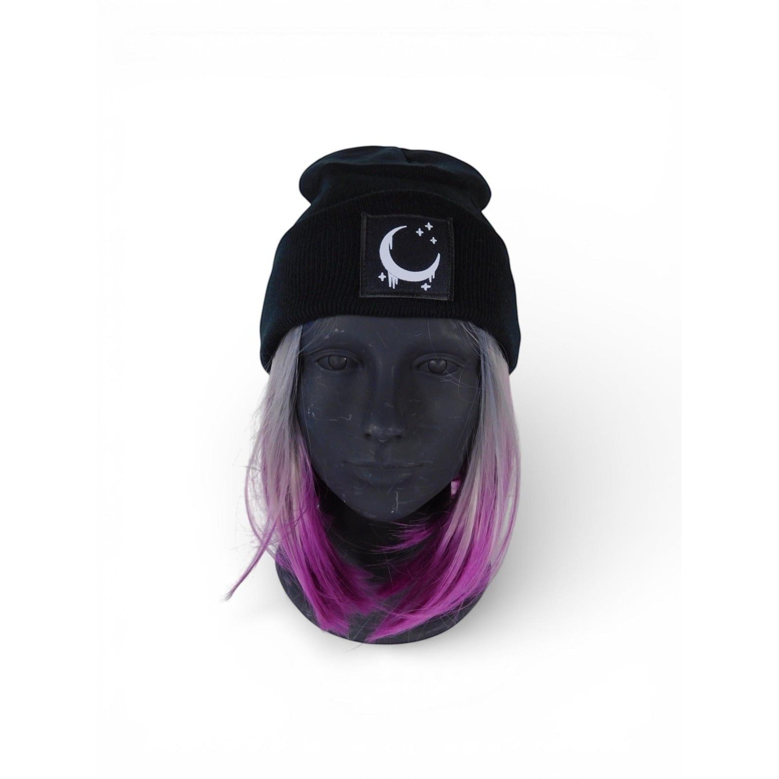 The Witches' Quest black ribbed knit beanie with a crescent moon and stars patch and satin lining on a mannequin head