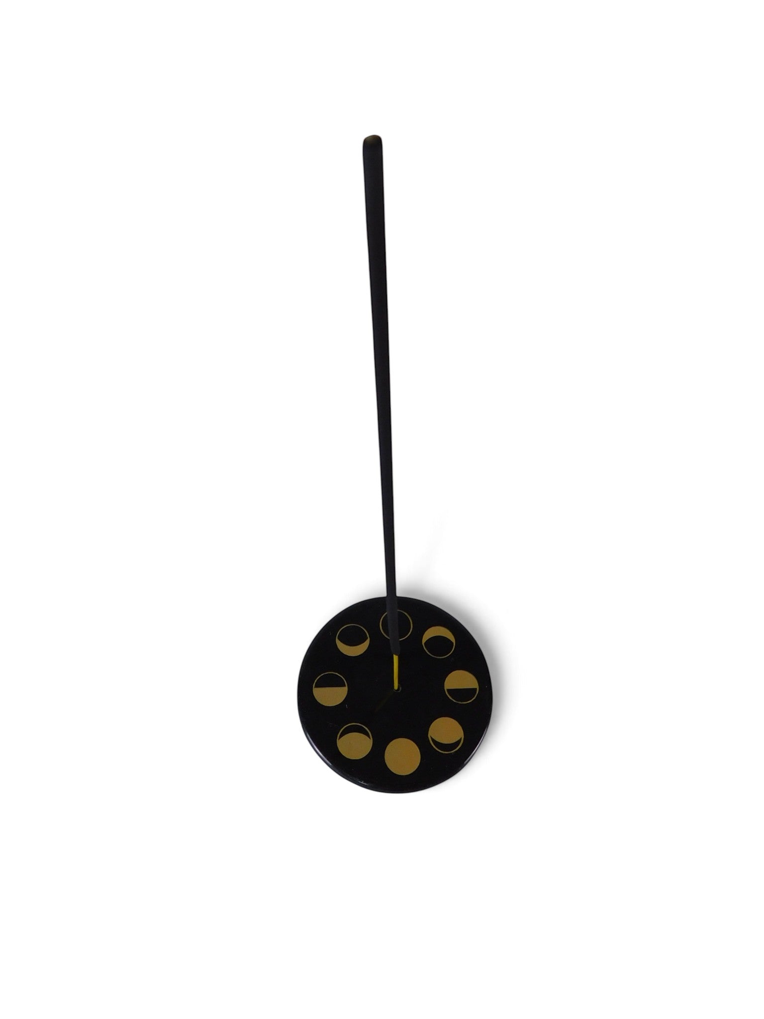 The Witches' Quest black ceramic incense holder featuring a gold celestial moon phase design on a round stone plate.