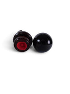 The Witches' Quest polished black obsidian sphere with a dark wooden display stand featuring a red velvet interior.
