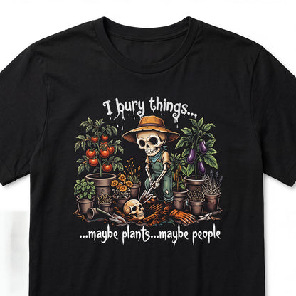 The Witches' Quest black cotton t-shirt featuring a skeleton gardener graphic with the text I bury things maybe plants