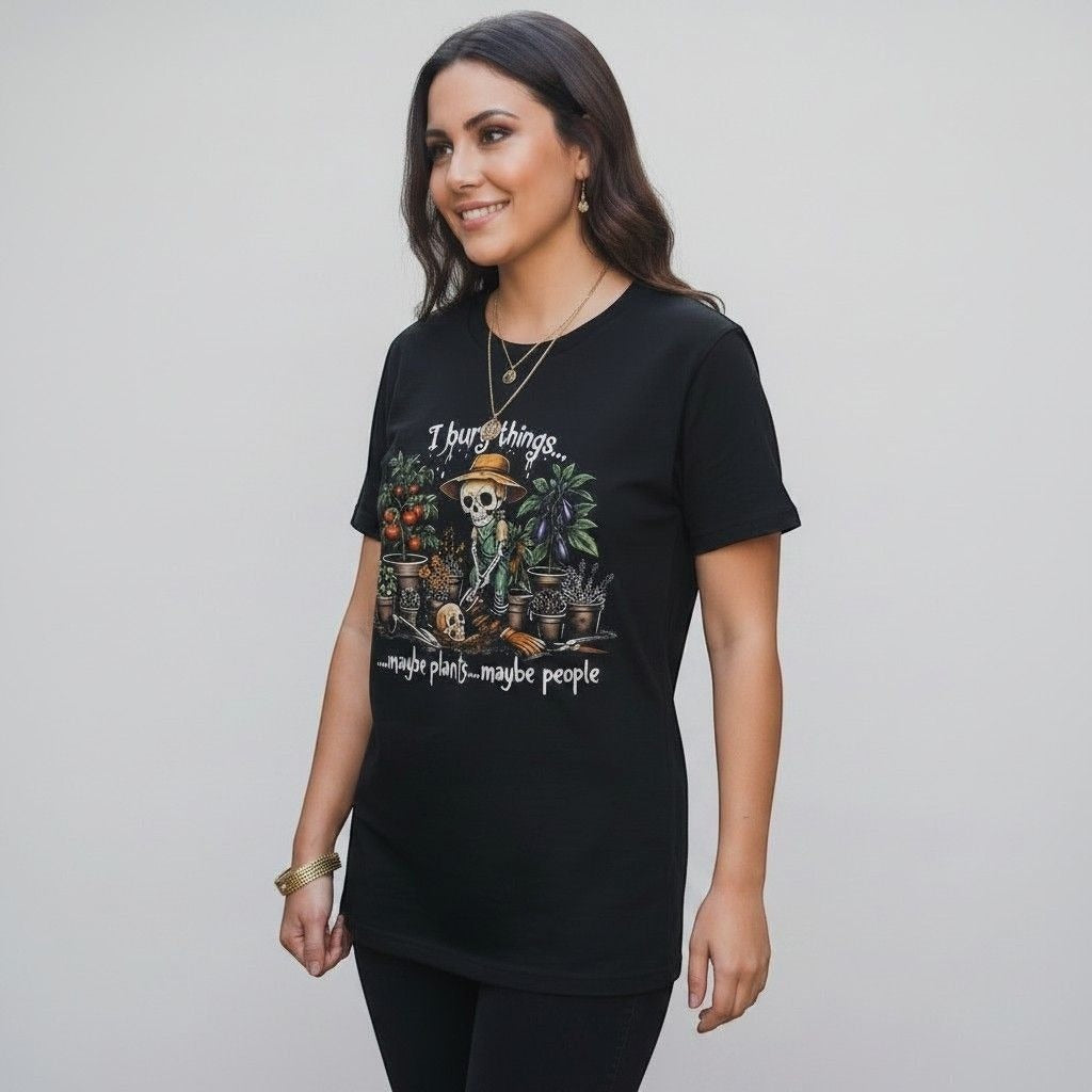 The Witches' Quest black cotton t-shirt featuring a skeleton gardener graphic with the text I bury things