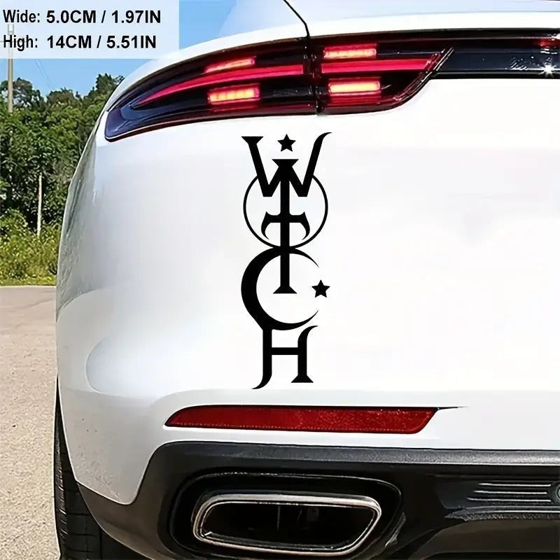 The Witches' Quest black vinyl witch decal applied to the rear bumper of a white car