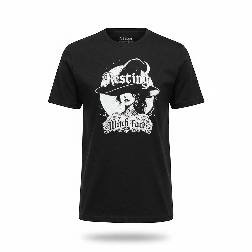 The Witches' Quest black cotton crew neck t-shirt featuring a white Resting Witch Face graphic print.