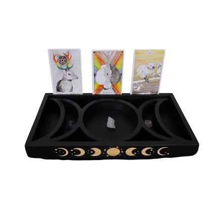 The Witches' Quest black wooden tarot card and crystal display tray featuring a triple moon phase engraving.