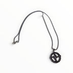 The Witches' Quest silver tone St. Brigid’s Cross pendant necklace with a woven circle design and matching link chain.