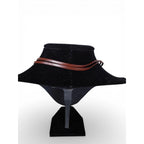 The Witches' Quest brown leather cord necklace on a black display bust, featuring a minimalist rustic design.